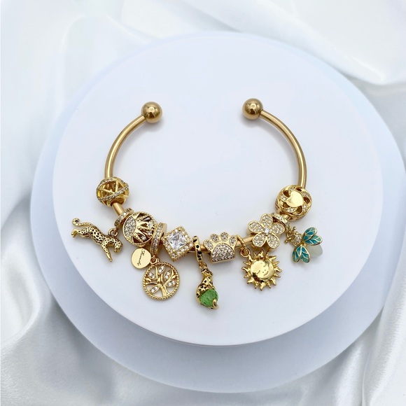 Linx Yellow Gold Stainless Steel Open Bangle with Gold Zircon and Green Charms